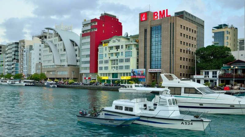 Bank of Maldives head office in Malé, with the red BML logo on the waterfront.