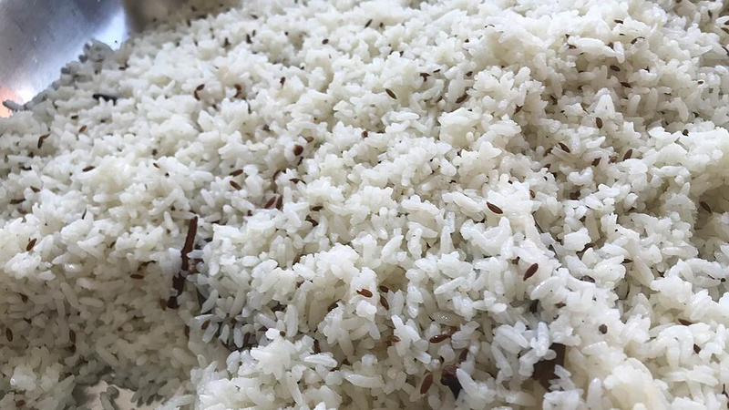 A plate of rice cooked with cumin and onion.