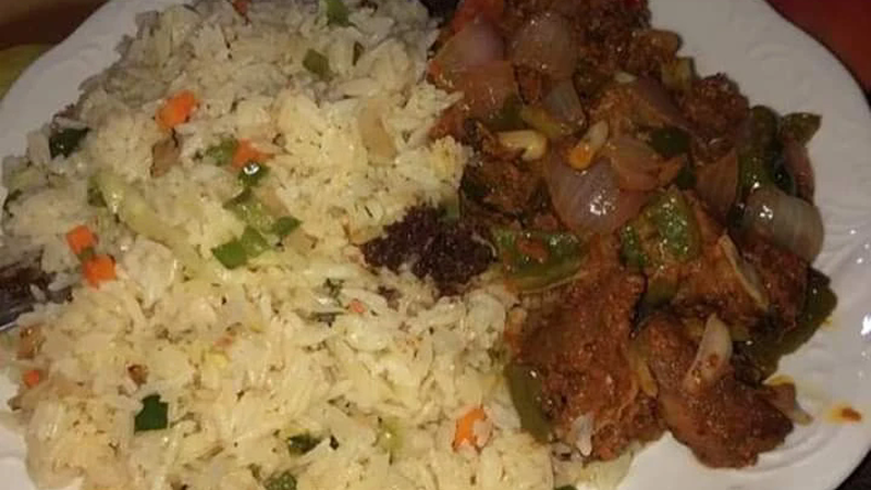 Fried rice with cabbage and green peas.
