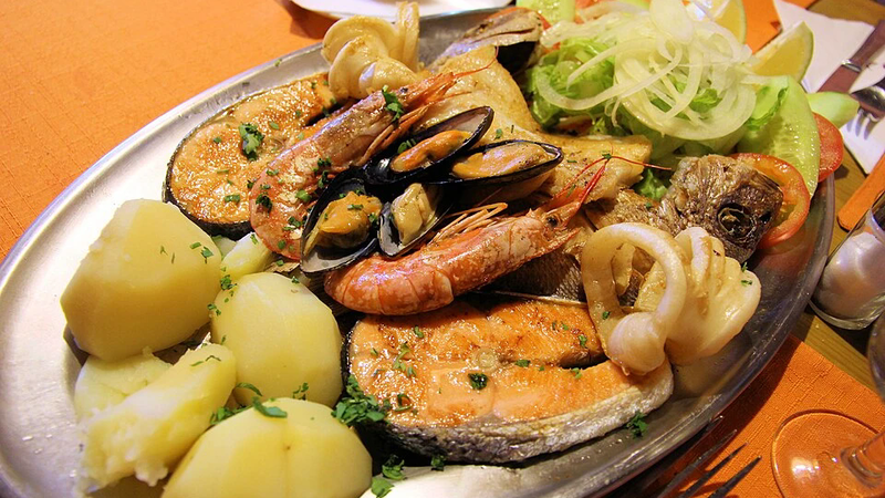 A plate of grilled fish and seafood.