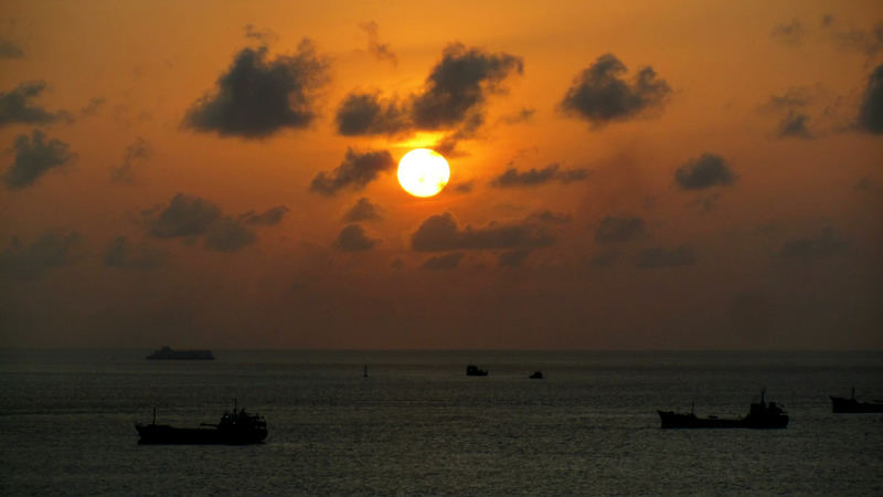 Sunset over ships in Malé harbour