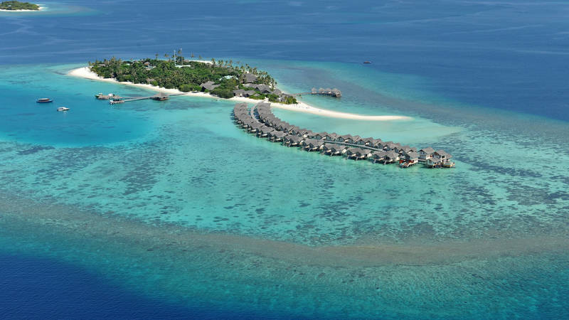 Aerial view of Maamigili Island and its lagoon in Raa Atoll, Maldives
