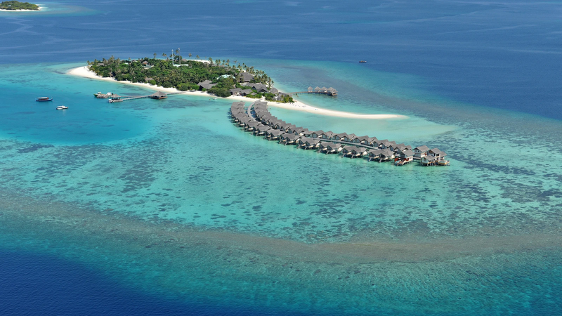 Aerial view of Maamigili Island and its lagoon in Raa Atoll, Maldives
