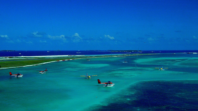 Seaplanes lined up on the water runway near Velana International Airport