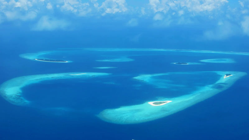 Aerial view of reefs and small islands in Baa Atoll, Maldives