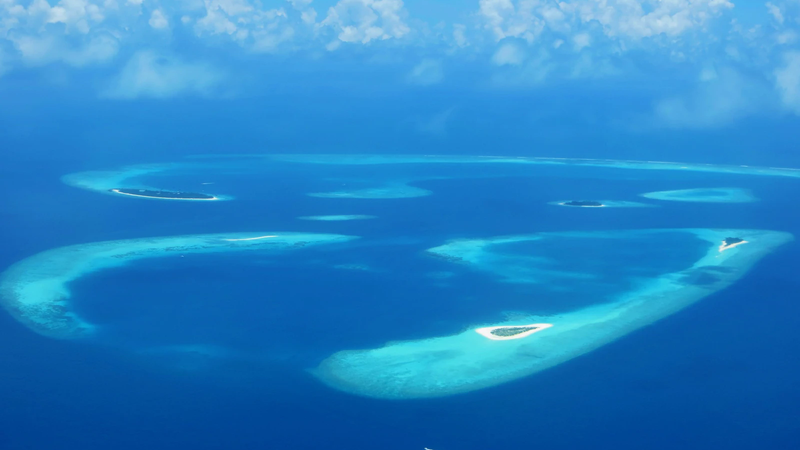 Aerial view of reefs and small islands in Baa Atoll, Maldives